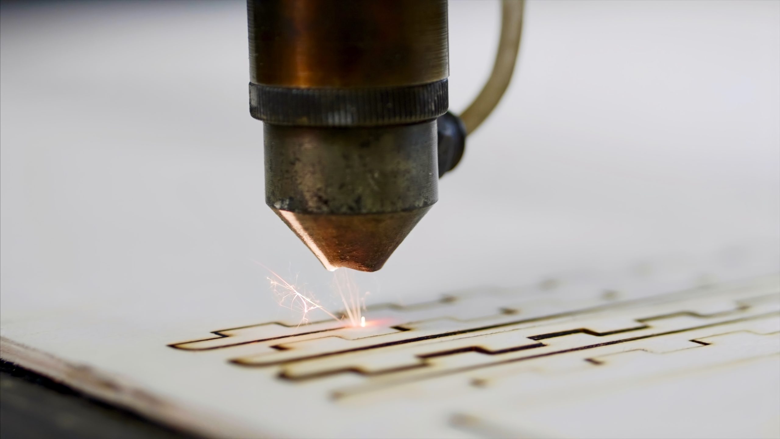 industrial-laser-is-cutting-a-pattern-on-a-plywood